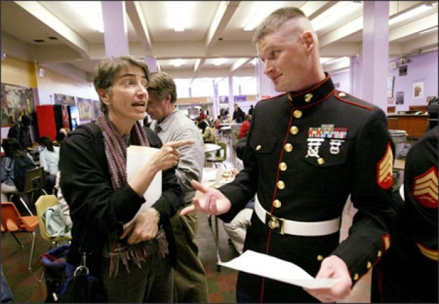 Amy Hagopian, co-chairwoman of the Garfield High PTSA, lights up Marine Sgt. Christopher Matthews in the school lunchroom. Hagopian is trying to get military recruiters barred from the school. The Marines and the Army have failed to meet recruiting quotas in recent months. Photo: Dan DeLong/Seattle Post-Intelligencer