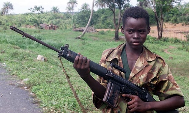  A 2000 image of a 14-year-old soldier in Sierra Leone Photograph: Adam Butler/AP 