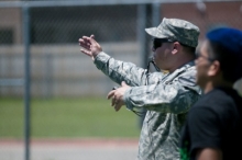 A Soldier with the 1st Battalion, 12th Cavalry Regiment, 3rd Armored Brigade Combat Team, 1st Cavalry Division referees a flag football game at Shoemaker High School during an organization day for the Junior Reserve Officer Training Corps cadets at Killeen, Texas, May 29. Soldiers helped organize the events, referee games, and foster a safe environment. (U.S. Army photo by Sgt. Brandon Banzhaf, 3rd Armored Brigade Combat Team, 1st Cavalry Division)